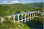 Cize-Bolozon viadukt

A Cize-Bolozon viadukt egy 273 méter hosszú közúti-vasúti völgyhíd a franciaországi Ain folyó felett. Az eredeti híd 1875-ben épült, azonban a második világháború alatt teljesen elpusztult, de újraépítették, és 1950 májusában át is adták. A híd része a Bourg-en-Bresse-Bellegarde-vasútvonalnak, az alsó szinten pedig közút található.
