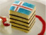 Izland

Izlandon a hagyományos sütemény az úgynevezett vínarterta torta, amit csíkos hölgytortának is hívnak a rétegei miatt. Mandula és/vagy kardamom ízű keksz és szilvalekvár váltakozó rétegeiből készül az édesség, a lekvárt pedig olyan fűszerekkel ízesítik, mint a fahéj, a vanília és a szegfűszeg. A sütit kávéval együtt szolgálják fel karácsony napján.
