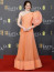 Emma Stone ebben a barackos Louis Vuitton ruhában érkezett a díjátadóra, ahol&nbsp;a&nbsp;Szegény párák című filmben&nbsp;nyújtott alakításáért&nbsp;megnyerte a legjobb női főszereplőnek járó díjat.
